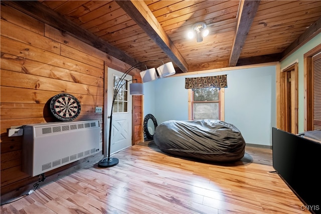 bedroom featuring wooden ceiling, beamed ceiling, and hardwood / wood-style floors