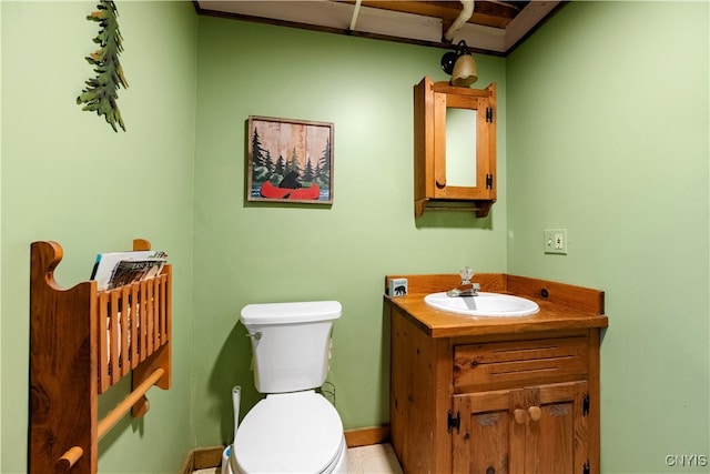 bathroom with toilet and vanity