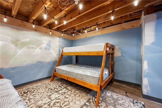 bedroom with hardwood / wood-style flooring