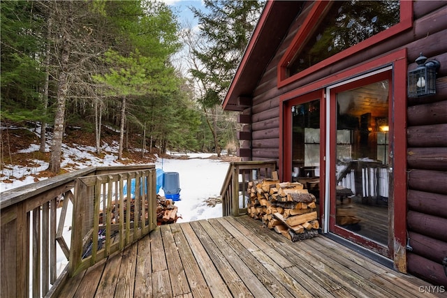 view of snow covered deck