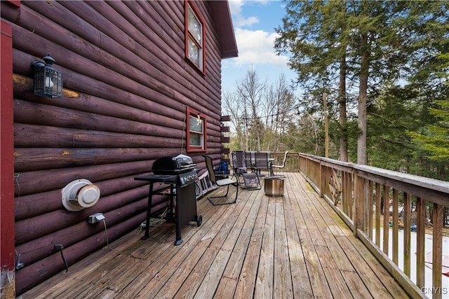 wooden deck with grilling area