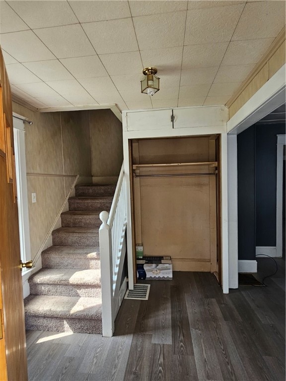 staircase featuring hardwood / wood-style flooring