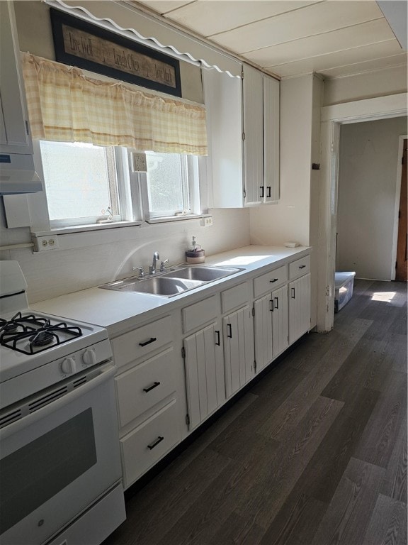 kitchen with dark hardwood / wood-style flooring, sink, gas range gas stove, and white cabinets