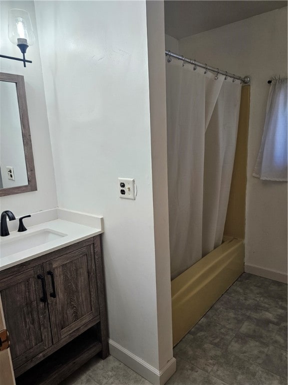 bathroom featuring vanity and shower / bath combo