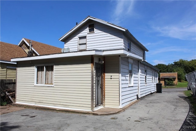 view of property exterior featuring fence