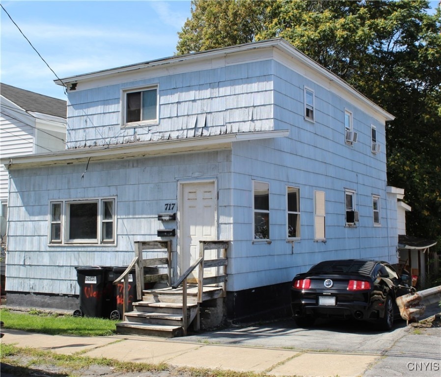 view of front of home featuring cooling unit