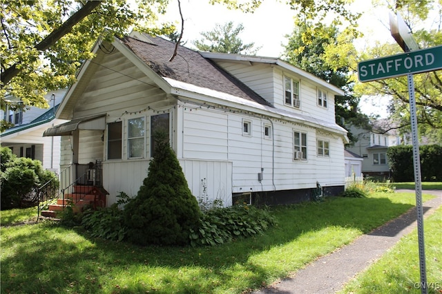 view of home's exterior featuring a lawn