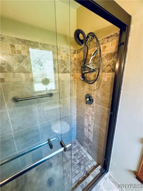 bathroom with an enclosed shower