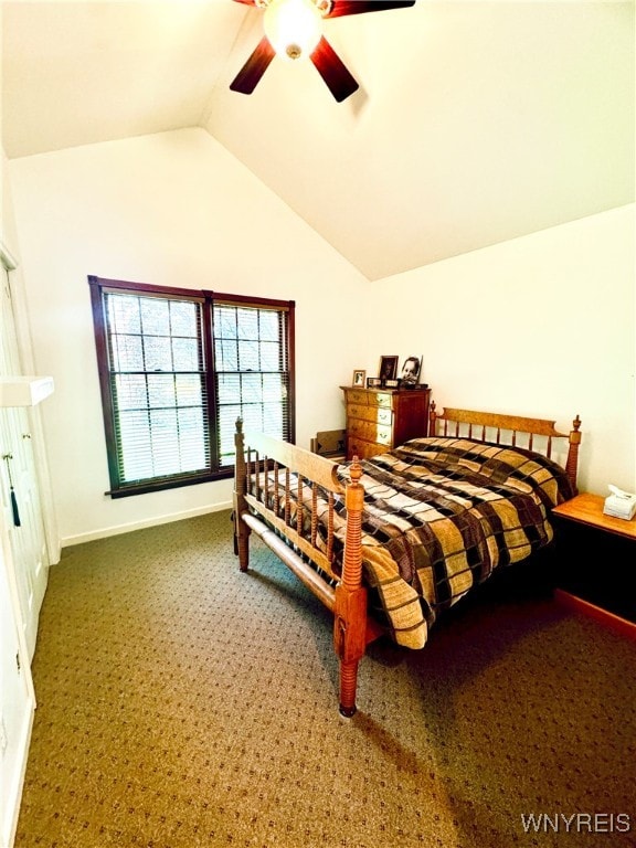 bedroom with ceiling fan, lofted ceiling, and carpet flooring