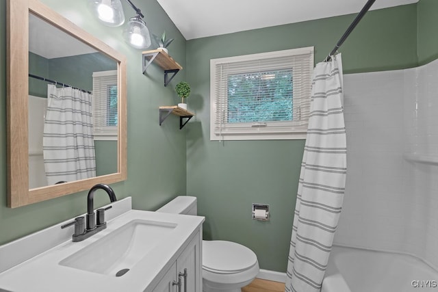 full bathroom with vanity, toilet, and shower / bath combination with curtain