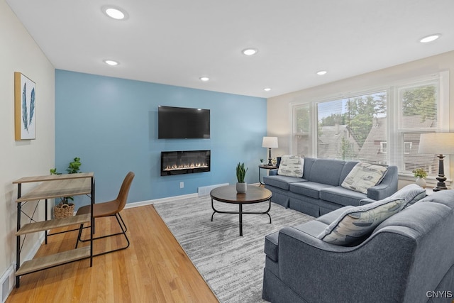 living room with light hardwood / wood-style flooring