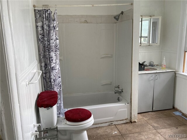 full bathroom with tile patterned flooring, vanity, shower / bath combination with curtain, and toilet