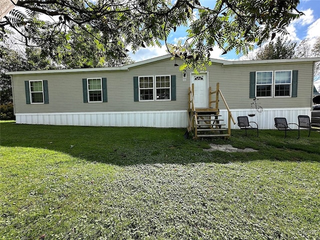 manufactured / mobile home with a front lawn