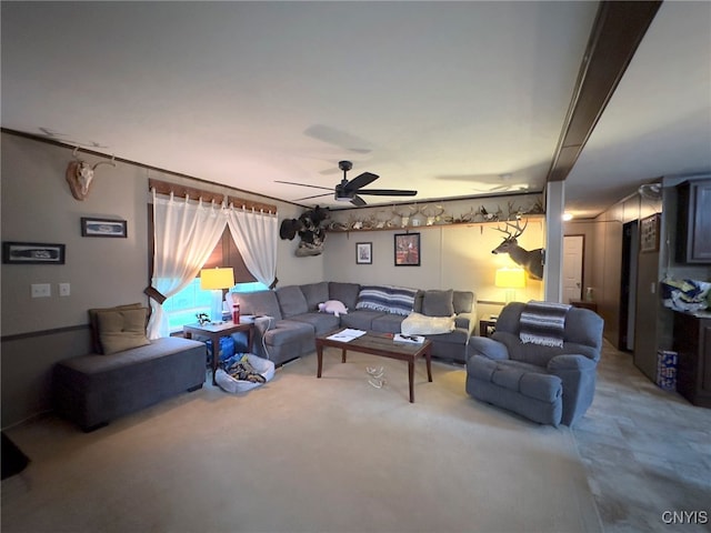 living room featuring carpet and ceiling fan