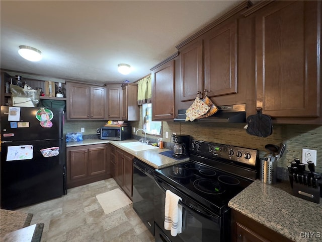 kitchen featuring black appliances, sink, decorative backsplash, and extractor fan