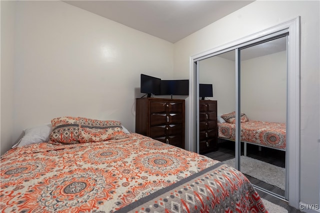 carpeted bedroom with a closet