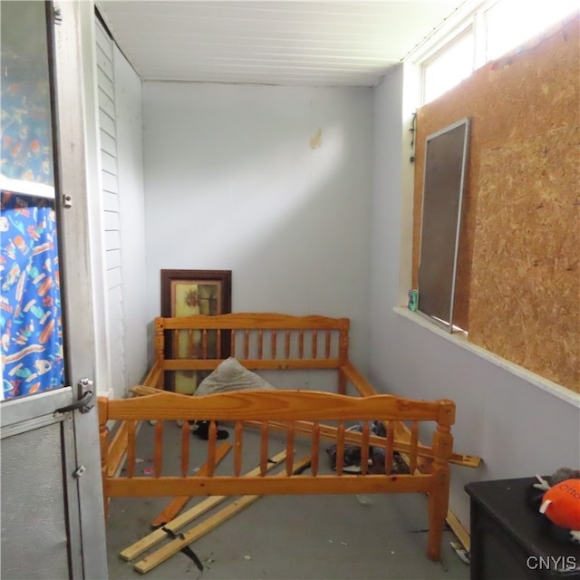 bedroom with concrete floors