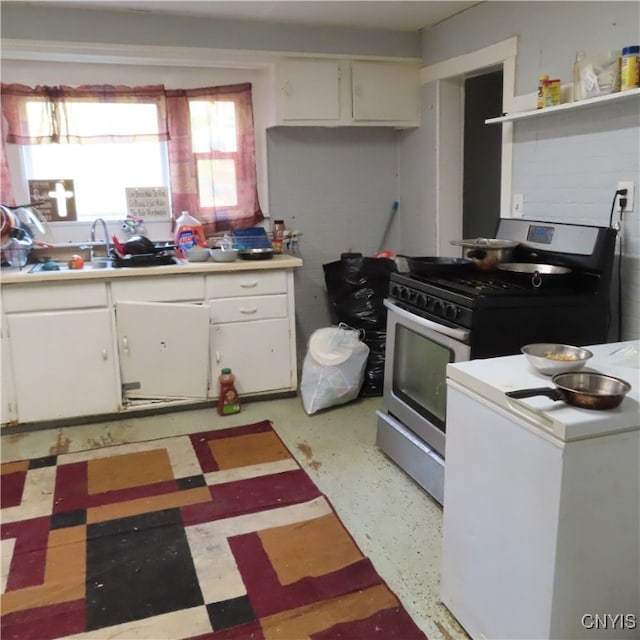 kitchen with white cabinetry and range with gas cooktop