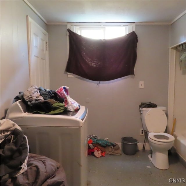 washroom featuring washer / clothes dryer and crown molding