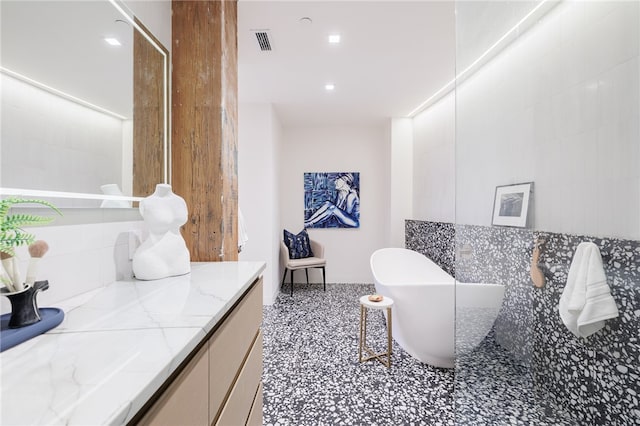 bathroom featuring a bath and vanity