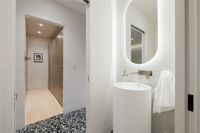 bathroom with wood-type flooring and vanity