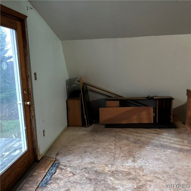 additional living space featuring vaulted ceiling