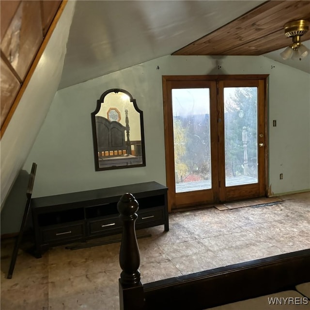 interior space with lofted ceiling, wooden ceiling, and ceiling fan