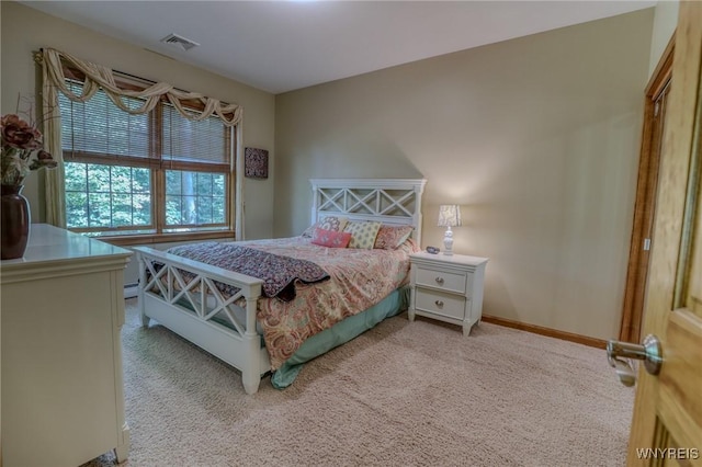 bedroom featuring carpet flooring and baseboard heating