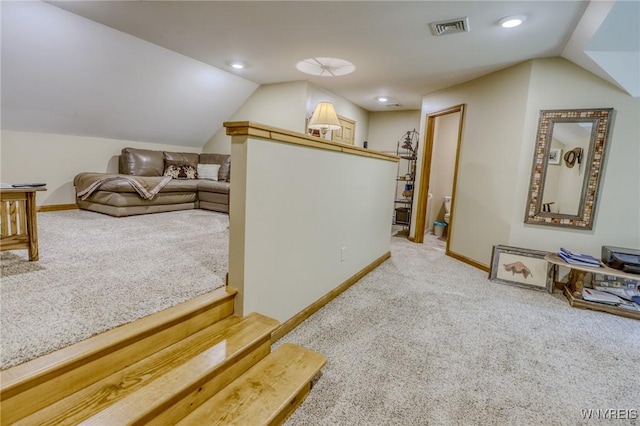 additional living space with light carpet and lofted ceiling