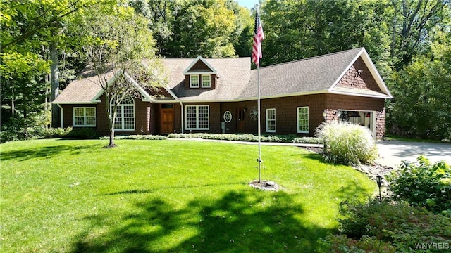 view of front of house with a garage and a front yard