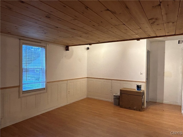 basement with wood ceiling and light wood-type flooring