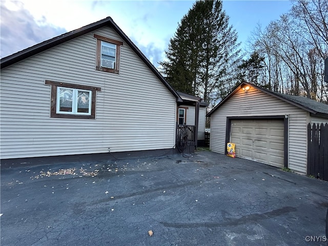 view of side of property with an outbuilding and a garage