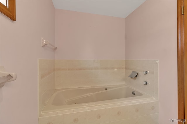 bathroom featuring a relaxing tiled tub