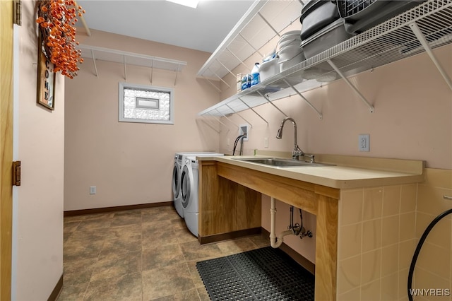 laundry room featuring washer and dryer and sink