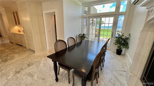 dining room with a wall mounted AC