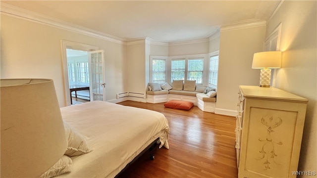 bedroom featuring wood-type flooring and ornamental molding