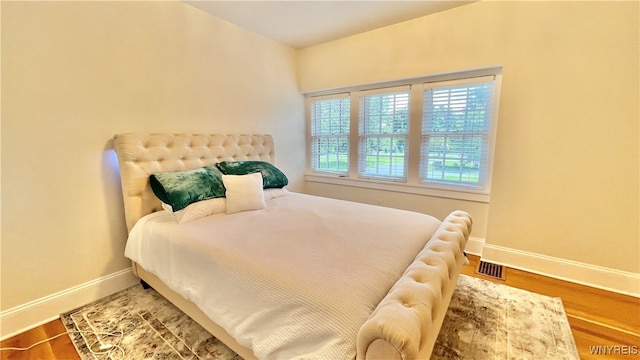 bedroom featuring hardwood / wood-style floors