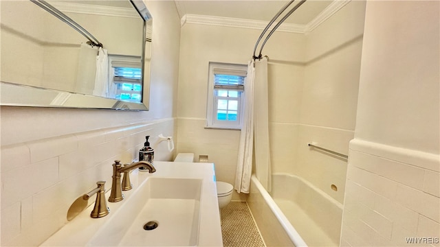 full bathroom featuring sink, tile patterned flooring, shower / bathtub combination with curtain, tile walls, and ornamental molding