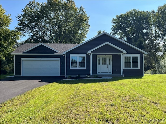 ranch-style home with a garage, a porch, and a front lawn