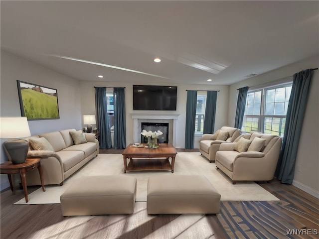 living room featuring hardwood / wood-style floors and a fireplace