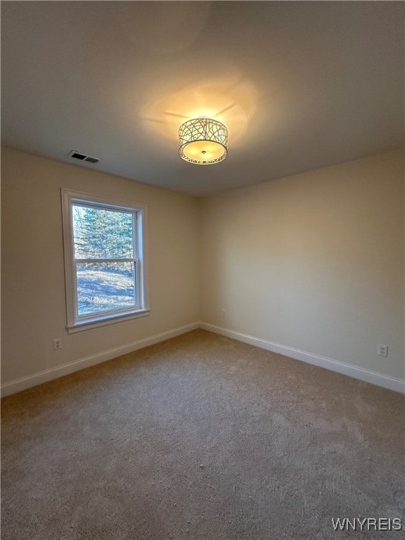 view of carpeted spare room