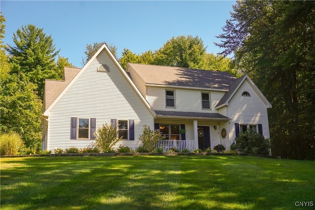 view of front of house with a front yard and a porch