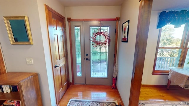 entryway featuring light hardwood / wood-style flooring and a healthy amount of sunlight