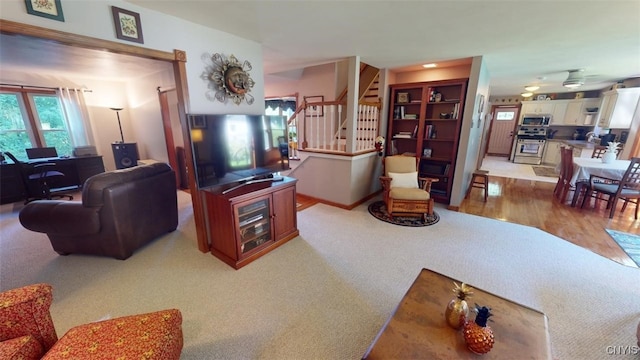 living room featuring light carpet