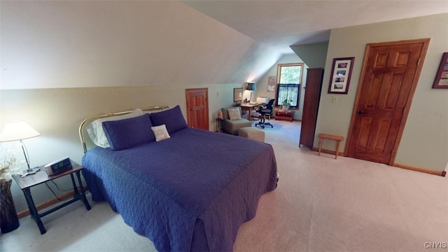 carpeted bedroom with vaulted ceiling