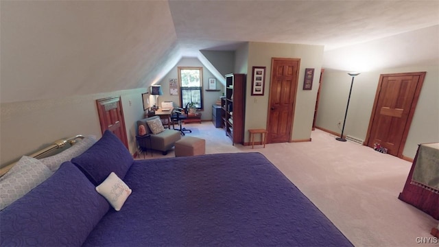 carpeted bedroom with vaulted ceiling