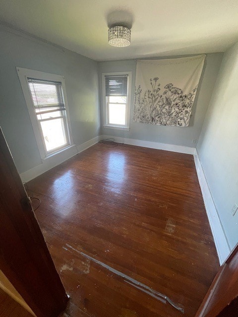 empty room featuring dark wood-type flooring