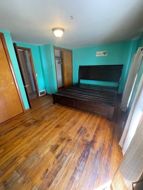 bedroom featuring wood-type flooring