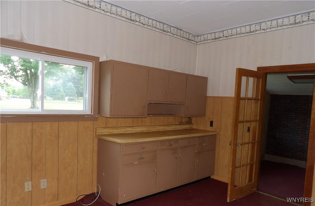 kitchen featuring wooden walls