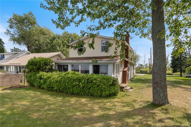 view of home's exterior with a yard